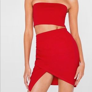 red asymmetrical top and skirt set